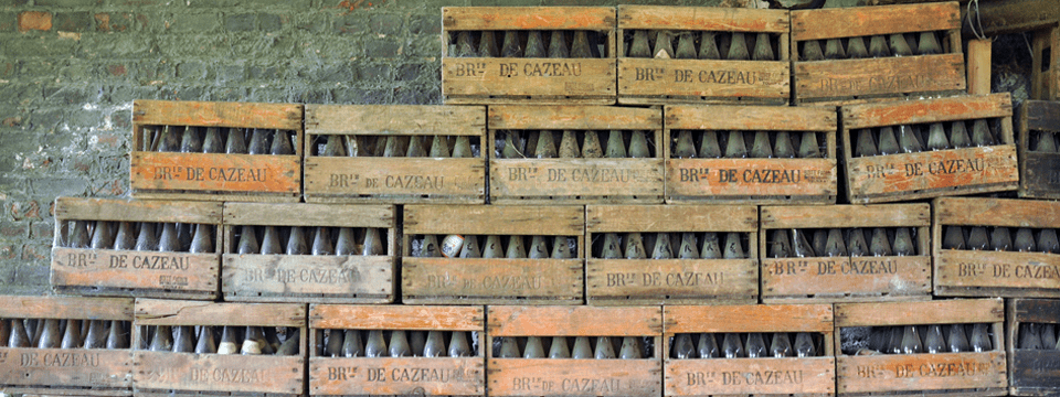 Cajas de botellas antiguas de la Brasserie de Cazeau